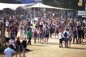 People walking around on Roskilde Festivalsquare